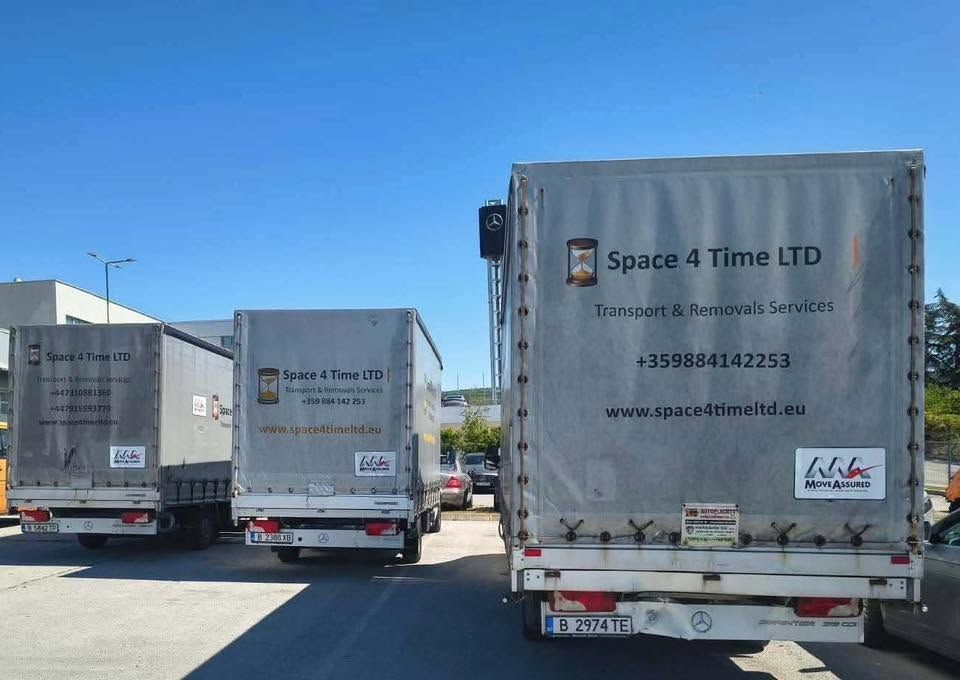 Space 4 Time Ltd branded removal trucks lined up