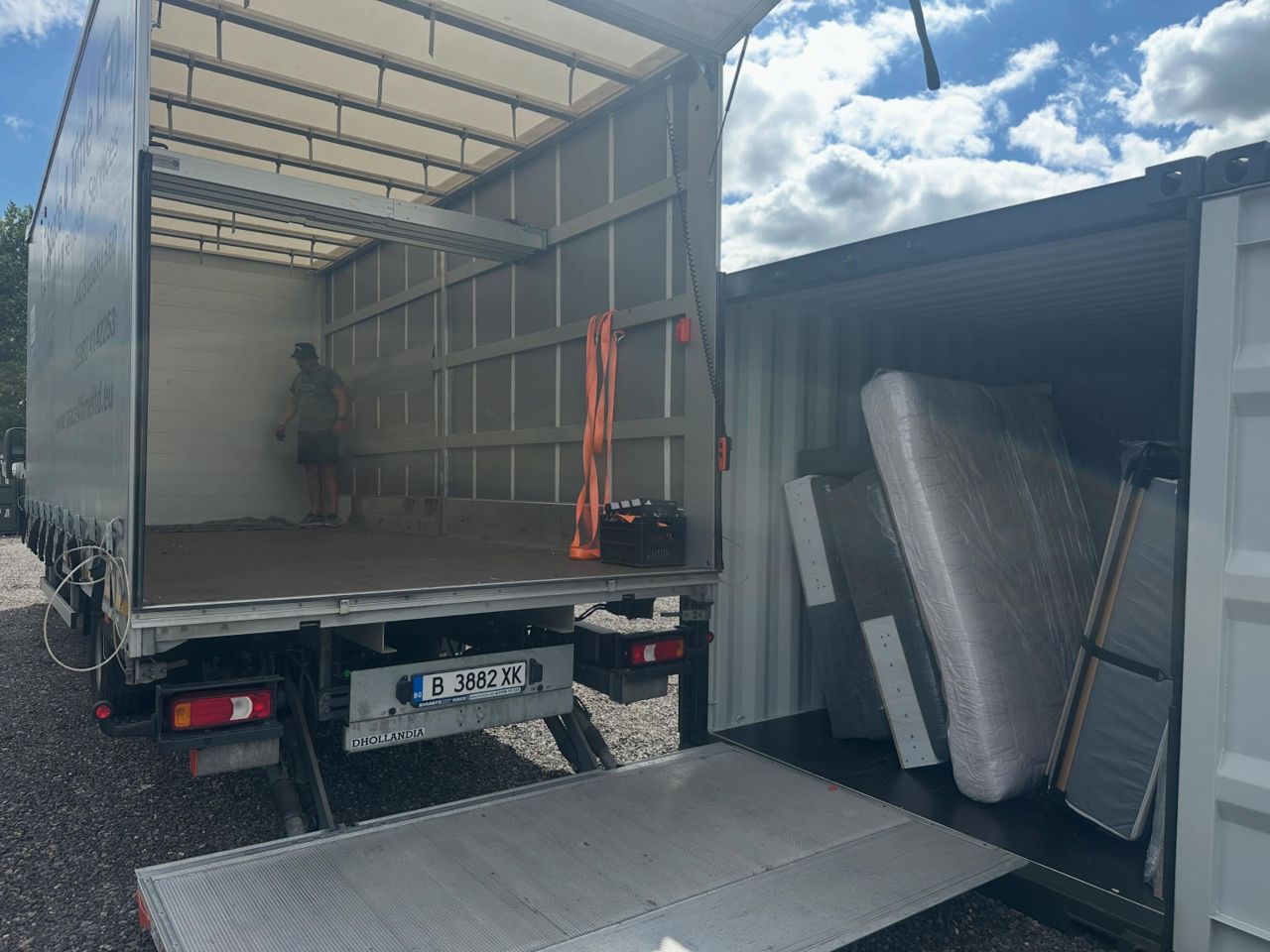 Loading furniture from removal truck into secure storage container