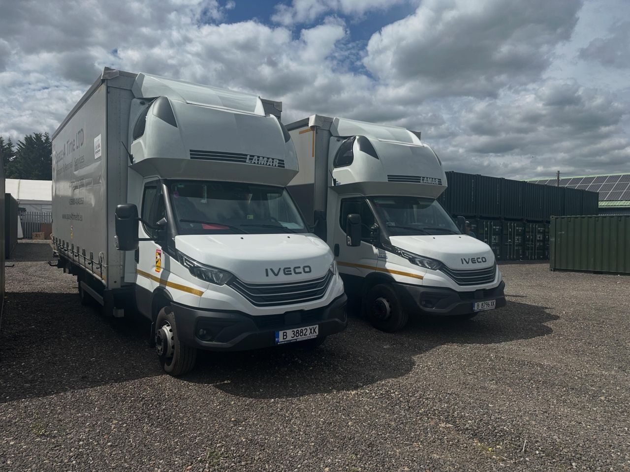 Two Iveco Daily removal trucks at the storage depot