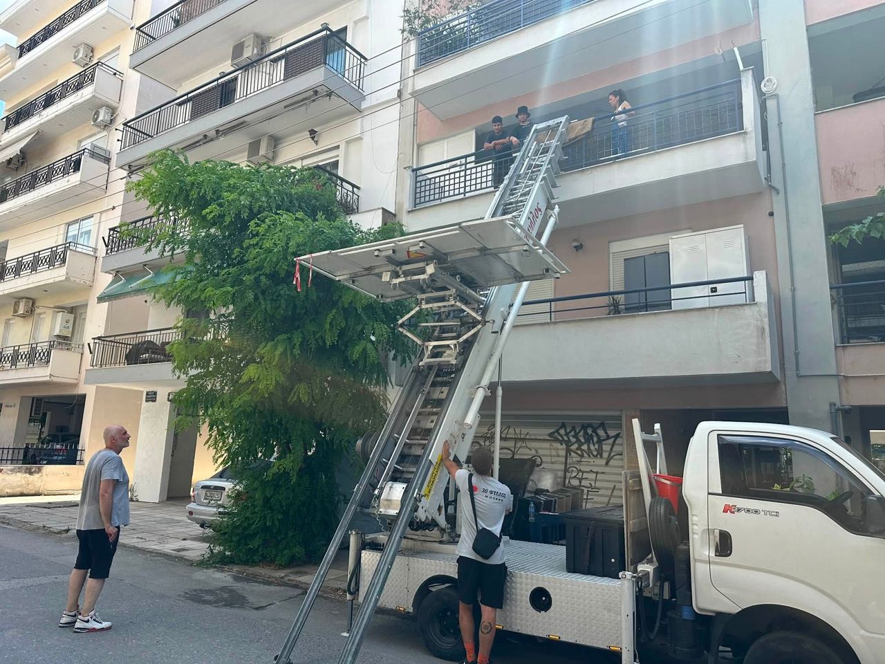 External furniture lift raised to an apartment balcony
